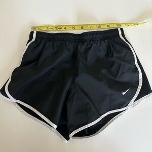 Nike athletic shorts black with white Nike symbol
